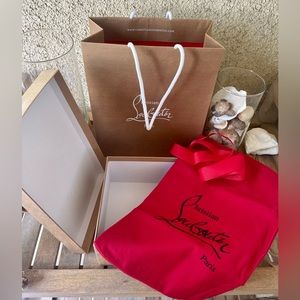 Christian Louboutin shoe box, shoe dust bag, and shopping bag.